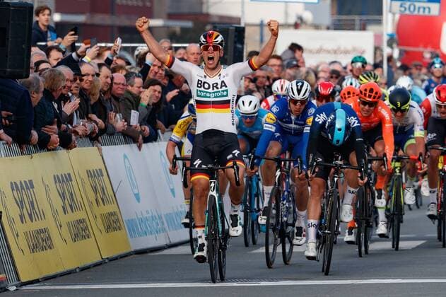 Sport Themen der Woche KW12 Sport Bilder des Tages German Pascal Ackermann of Bora-Hansgrohe (L) celebrates as he crosses the finish line to win, before Norwegian Kristoffer Halvorsen of Team Sky (R) and Colombian Alvaro Jose Hodeg of Deceuninck - Quick-Step (C) the sprint at the finish line to win the Bredene Koksijde Classic cycling race, Friday 22 March 2019, 197,5km in Koksijde. KURTxDESPLENTER  x05554025x