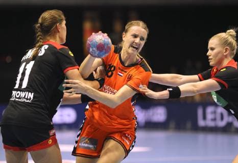 Photo on ball Kelly Dulfer against Kim Naidzinavicius Germany and left Xenia Smits handball international on Fr 22 03 2019 in Groningen Netherlands Germany 29 26