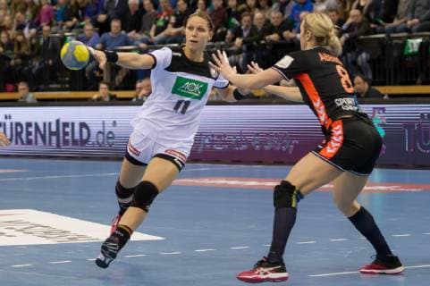 v li Xenia Smits Germany 11 and Lois Abbingh Netherlands Nederland 8 in duel duel game scene action handball international women Germany Netherlands xobx
