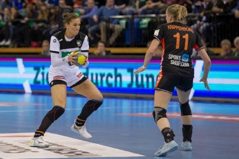 v li Julia Behnke Germany 13 and Lynn Knippenborg Netherlands Nederland 11 in duel duel game scene action handball international women Germany Netherlands xobx
