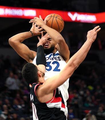 April 1, 2019 - Minneapolis, MN, USA - Minnesota Timberwolves Karl-Anthony Towns gets hit in the face by Portland Trailblazers Enes Kanter in the 3rd quarter but no foul was called. ..brian.peterson@startribune.com..Minneapolis, MN ..Monday, April 1, 2019 1008452054 1WOLF040219 - ZUMAm42_ 90449767st Copyright: xBrianxPetersonx