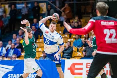 Daniel Zele 28 Dessau Rosslauer HV 06 Max Bauer 29 DJK Rimpar Wölfe Max Brustmann 22 DJK Rimpar Wölfe during the match in the Handball 2 Bundesliga Men Season 2018 2019 between Dessau Rosslauer HV 06 and DJK Rimpar Wölfe in the Anhalt Arena on 5 April 2019 in Dessau Rosslau Saxony Anhalt Germany