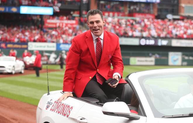 St. Louis Cardinals Hall of Fame member Jim Edmonds yells into the San Diego Padres dugout as he rides in a car around the Busch Stadium track on Opening Day in St. Louis on April 5, 2019.  SLP2019040529 BILLxGREENBLATT