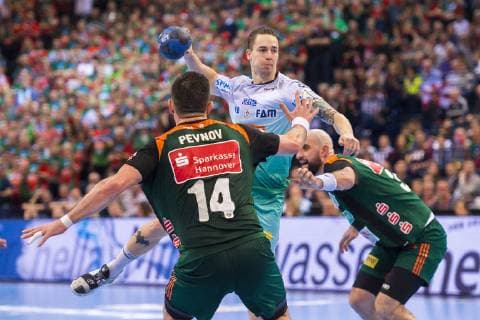 Hamburg Germany 06 April 2019 REWE Final 4 DHB Cup Semifinal TSV Hannover Burgdorf vs SC Magdeburg v li Evgeni Pevnov Hannover Michael Damgaard Magdeburg Domagoj Srsen Hannover Hamburg Barclaycard Arena Hamburg Germany
