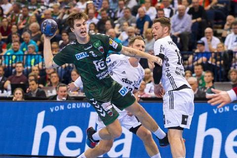 Hamburg Germany 06 April 2019 REWE Final 4 DHB Cup Semifinal THW Kiel vs Fuechse Berlin Jacob Tandrup Holm Berlin Niclas Ekberg THW Kiel Hamburg Barclaycard Arena Hamburg Germany