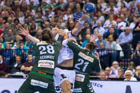 Hamburg Germany 06 April 2019 REWE Final 4 DHB Cup Semifinal THW Kiel vs Fuechse Berlin v left in duel Erik Schmidt Berlin Steffen Weinhold THW Kiel Matthias Zachrisson Berlin Hamburg Barclaycard Arena Hamburg Germany