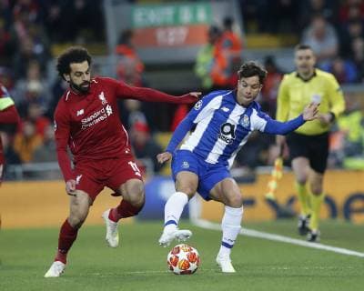 Mohamed Salah of Liverpool tackles Oliver Torres of FC Porto during the UEFA Champions League match at Anfield, Liverpool. Picture date: 9th April 2019. Picture credit should read: Andrew Yates Sportimage EDITORIAL USE ONLY. No use with unauthorised audio, video, data, fixture lists, club league logos or live services. Online in-match use limited to 120 images, no video emulation. No use in betting, games or single club league player publications. SPI-0024-0020