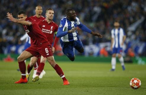 Moussa Marega FC Porto brought down by Dejan Lovren of Liverpool during the UEFA Champions League match at Anfield, Liverpool. Picture date: 9th April 2019. Picture credit should read: Andrew Yates Sportimage EDITORIAL USE ONLY. No use with unauthorised audio, video, data, fixture lists, club league logos or live services. Online in-match use limited to 120 images, no video emulation. No use in betting, games or single club league player publications. SPI-0024-0021