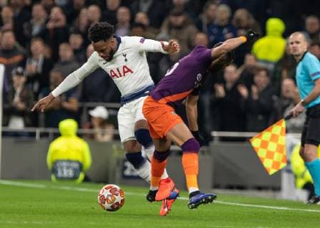 Football - 2018 2019 UEFA Champions League - Quarter Final , First Leg: Tottenham Hotspur vs. Manchester City Danny Rose (Tottenham FC) tangles with Riyad Mahrez (Manchester City) at White Hart Lane Stadium. COLORSPORT DANIEL BEARHAM 