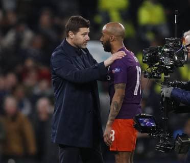 Mauricio Pochettino manager of Tottenham chats to Fabian Delph of Manchester City during the UEFA Champions League match at the Tottenham Hotspur Stadium, London. Picture date: 9th April 2019. Picture credit should read: Darren Staples Sportimage EDITORIAL USE ONLY. No use with unauthorised audio, video, data, fixture lists, club league logos or live services. Online in-match use limited to 120 images, no video emulation. No use in betting, games or single club league player publications. SPI-0025-0078
