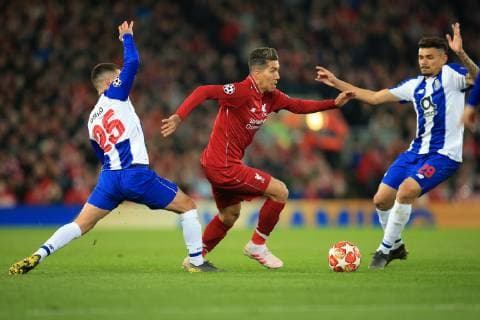 9th April 2019, Anfield, Liverpool, England; UEFA Champions League football, quarter final 1st leg, Liverpool versus FC Porto; Roberto Firmino of Liverpool takes on Otavio and Francisco Soares of Porto  ActionPlus12122493 DavidxBlunsden