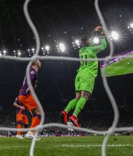 (190410) -- LONDON, April 10, 2019 (Xinhua) -- Manchester City s Ederson (Above) jumps to save the ball during the UEFA Champions League Quater Final First Leg match between Tottenham Hotspur and Manchester City at The Tottenham Hotspur Stadium in London, Britain on April 9, 2019. Tottenham Hotspur won 1-0. (Xinhua Han Yan) FOR EDITORIAL USE ONLY. NOT FOR SALE FOR MARKETING OR ADVERTISING CAMPAIGNS. NO USE WITH UNAUTHORIZED AUDIO, VIDEO, DATA, FIXTURE LISTS, CLUB LEAGUE LOGOS OR LIVE SERVICES. ONLINE IN-MATCH USE LIMITED TO 45 IMAGES, NO VIDEO EMULATION. NO USE IN BETTING, GAMES OR SINGLE CLUB LEAGUE PLAYER PUBLICATIONS. (SP)BRITAIN-LONDON-FOOTBALL-CHAMPIONS LEAGUE-QUARTERFINAL-TOT HOTSPUR VS MAN CITY
