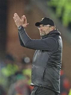 (190410) -- LIVERPOOL, April 10, 2019 (Xinhua) -- Liverpool s manager Jurgen Klopp gestures after the UEFA Champions League Quarter-final first leg match between Liverpool FC and FC Porto at Anfield in Liverpool, Britain on April 9, 2019. Liverpool won 2-0. (Xinhua) FOR EDITORIAL USE ONLY. NOT FOR SALE FOR MARKETING OR ADVERTISING CAMPAIGNS. NO USE WITH UNAUTHORIZED AUDIO, VIDEO, DATA, FIXTURE LISTS, CLUB LEAGUE LOGOS OR LIVE SERVICES. ONLINE IN-MATCH USE LIMITED TO 45 IMAGES, NO VIDEO EMULATION. NO USE IN BETTING, GAMES OR SINGLE CLUB LEAGUE PLAYER PUBLICATIONS. (SP)BRITAIN-LIVERPOOL-FOOTBALL-UEFA CHAMPIONS LEAGUE-LIVERPOOL VS FC PORTO