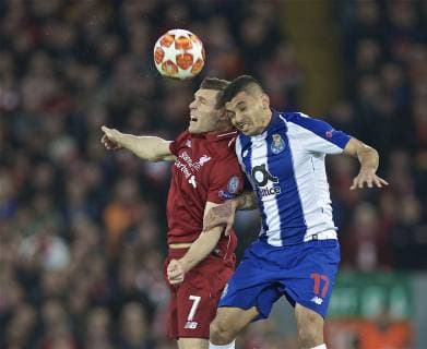 (190410) -- LIVERPOOL, April 10, 2019 (Xinhua) -- Liverpool s James Milner (L) vies with FC Porto s Jesus Corona during the UEFA Champions League Quarter-final first leg match between Liverpool FC and FC Porto at Anfield in Liverpool, Britain on April 9, 2019. Liverpool won 2-0. (Xinhua) FOR EDITORIAL USE ONLY. NOT FOR SALE FOR MARKETING OR ADVERTISING CAMPAIGNS. NO USE WITH UNAUTHORIZED AUDIO, VIDEO, DATA, FIXTURE LISTS, CLUB LEAGUE LOGOS OR LIVE SERVICES. ONLINE IN-MATCH USE LIMITED TO 45 IMAGES, NO VIDEO EMULATION. NO USE IN BETTING, GAMES OR SINGLE CLUB LEAGUE PLAYER PUBLICATIONS. (SP)BRITAIN-LIVERPOOL-FOOTBALL-UEFA CHAMPIONS LEAGUE-LIVERPOOL VS FC PORTO