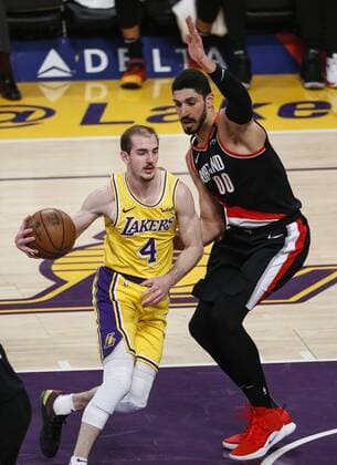 April 9, 2019 - Los Angeles, California, U.S - Los Angeles Lakers Alex Caruso (4) drives against Portland Trail Blazers Enes Kanter (00) during an NBA Basketball Herren USA basketball game between Los Angeles Lakers and Portland Trail Blazers, Tuesday, April 9, 2019, in Los Angeles. NBA 2019: Lakers 101:104 Trail Blazers - ZUMAc68_ 20190409_zaf_c68_039 Copyright: xRingoxChiux