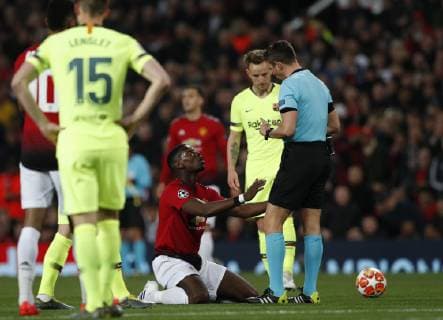 Paul Pogba of Manchester United ManU complains to referee Gianluca Rocchi during the UEFA Champions League match at Old Trafford, Manchester. Picture date: 10th April 2019. Picture credit should read: Darren Staples Sportimage EDITORIAL USE ONLY. No use with unauthorised audio, video, data, fixture lists, club league logos or live services. Online in-match use limited to 120 images, no video emulation. No use in betting, games or single club league player publications. SPI-0026-0023