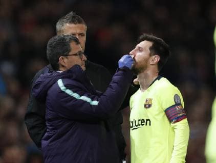 Lionel Messi of Barcelona gets an injury treated during the UEFA Champions League match at Old Trafford, Manchester. Picture date: 10th April 2019. Picture credit should read: Darren Staples Sportimage EDITORIAL USE ONLY. No use with unauthorised audio, video, data, fixture lists, club league logos or live services. Online in-match use limited to 120 images, no video emulation. No use in betting, games or single club league player publications. SPI-0026-0029