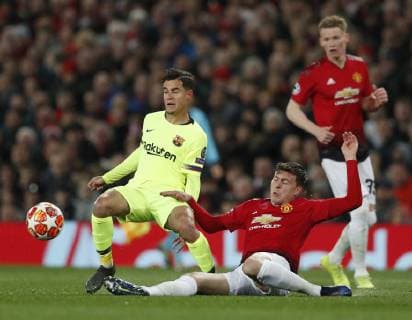 Philippe Coutinho of Barcelona tackled by Victor Lindelof of Manchester United ManU during the UEFA Champions League match at Old Trafford, Manchester. Picture date: 10th April 2019. Picture credit should read: Darren Staples Sportimage EDITORIAL USE ONLY. No use with unauthorised audio, video, data, fixture lists, club league logos or live services. Online in-match use limited to 120 images, no video emulation. No use in betting, games or single club league player publications. SPI-0026-0035
