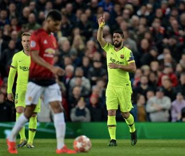 (190411) -- MANCHESTER, April 11, 2019 (Xinhua) -- Barcelona s Luis Suarez (R) celebrates an own-goal by Manchester United ManU s Luke Shaw during the UEFA Champions League Quarter-Final first leg match between Manchester United and FC Barcelona Barca at Old Trafford in Manchester, Britain on April 10, 2019. Barcelona won 1-0. (Xinhua) FOR EDITORIAL USE ONLY. NOT FOR SALE FOR MARKETING OR ADVERTISING CAMPAIGNS. NO USE WITH UNAUTHORIZED AUDIO, VIDEO, DATA, FIXTURE LISTS, CLUB LEAGUE LOGOS OR LIVE SERVICES. ONLINE IN-MATCH USE LIMITED TO 45 IMAGES, NO VIDEO EMULATION. NO USE IN BETTING, GAMES OR SINGLE CLUB LEAGUE PLAYER PUBLICATIONS. (SP)BRITAIN-MANCHESTER-FOOTBALL-CHAMPIONS LEAGUE-QUARTERFINAL-MAN UNITED VS BARCELONA 