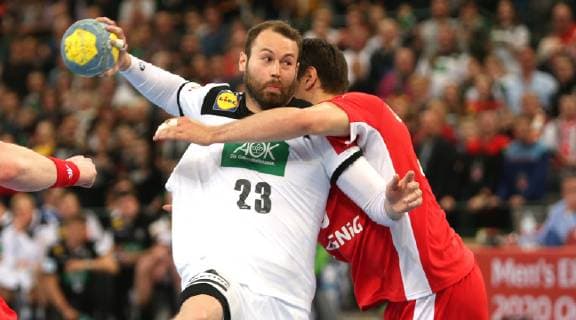 Steffen Fäth Germany vs. Piotr Chrapkowski Poland at the European Championship Qualifier Germany vs. Poland of the Men on 13 04 19 in the Gerry Weber Stadium in Halle Westfalen Handball European Championship Qualifier Germany Poland