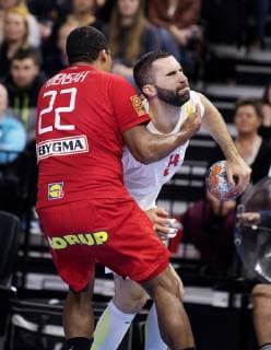 Mads Mensah Larsen and Milos Bozovic during the European Championship qualifiers in mens handball between Denmark and Montenegro in the Royal Arena Saturday 13 April 2019 Copenhagen Denmark,  Copyright: fotograf@clausbech.dk ClausxBechx COP102 spdk20190413-221739-L