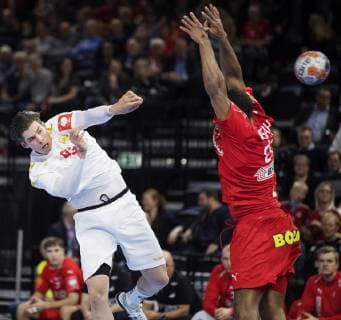 Vladan Lipovina and Mads Mensah Larsen during the European Championship qualifiers in mens handball between Denmark and Montenegro in the Royal Arena Saturday 13 April 2019 Copenhagen Denmark,  Copyright: fotograf@clausbech.dk ClausxBechx COP102 spdk20190413-222622-L
