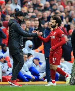 14th April 2019, Anfield, Liverpool, England; EPL Premier League football, Liverpool versus Chelsea; Mohamed Salah of Liverpool shakes hands and embraces Liverpool manager Jurgen Klopp as he is substituted  ActionPlus12124244 DavidxBlunsden