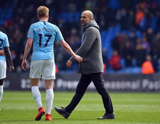 Manchester City Manager Josep Guardiola and Kevin De Bruyne of Manchester City at the end of the Premier League match at Selhurst Park, London. Picture date: 14th April 2019. Picture credit should read: Robin Parker Sportimage EDITORIAL USE ONLY. No use with unauthorised audio, video, data, fixture lists, club league logos or live services. Online in-match use limited to 120 images, no video emulation. No use in betting, games or single club league player publications. SPI-0030-0103