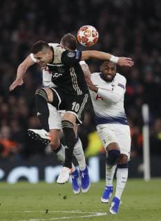 Dusan Tadic of Ajax challenged by Danny Rose of Tottenham during the UEFA Champions League match at the Tottenham Hotspur Stadium, London. Picture date: 30th April 2019. Picture credit should read: David Klein Sportimage EDITORIAL USE ONLY. No use with unauthorised audio, video, data, fixture lists, club league logos or live services. Online in-match use limited to 120 images, no video emulation. No use in betting, games or single club league player publications. SPI-0063-0106