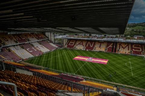 A large flag on the half way line before the game at valley parade to remember the victims of the 1985 fire disaster during the Sky Bet League 1 match between Bradford City and AFC Wimbledon at the Northern Commercial Stadium, Bradford, England on 4 May 2019. Copyright: xThomasxGaddx PMI-2806-0008
