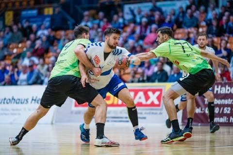 Yannick Dräger 19 TV Emsdetten Jonas Hoenicke 20 Dessau Rosslauer HV 06 Janko Bozovic 77 TV Emsdetten during the match in Handball 2 Bundesliga Men Season 2018 2019 between Dessau Rosslauer HV 06 and TV Emsdetten in the Anhalt Arena on 5 May 2019 in Dessau Rosslau Sachsen Anhalt Germany