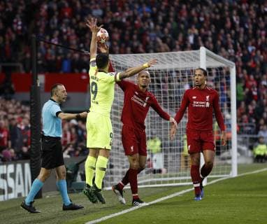 Liverpool s Fabinho tussles with Barcelona s Luis Suarez during the UEFA Champions League match at Anfield, Liverpool. Picture date: 7th May 2019. Picture credit should read: Darren Staples Sportimage EDITORIAL USE ONLY. No use with unauthorised audio, video, data, fixture lists, club league logos or live services. Online in-match use limited to 120 images, no video emulation. No use in betting, games or single club league player publications. SPI-0072-0029