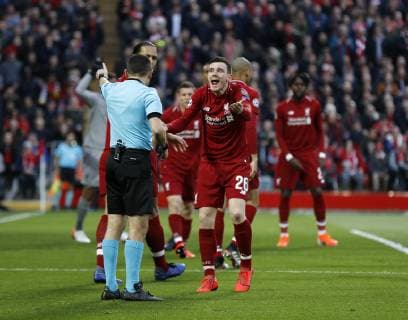 Liverpool s Andy Robertson argues with referee Cuneyt Cakir during the UEFA Champions League match at Anfield, Liverpool. Picture date: 7th May 2019. Picture credit should read: Darren Staples Sportimage EDITORIAL USE ONLY. No use with unauthorised audio, video, data, fixture lists, club league logos or live services. Online in-match use limited to 120 images, no video emulation. No use in betting, games or single club league player publications. SPI-0072-0031