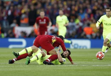Liverpool s Fabinho tussles with Barcelona s Luis Suarez during the UEFA Champions League match at Anfield, Liverpool. Picture date: 7th May 2019. Picture credit should read: Darren Staples Sportimage EDITORIAL USE ONLY. No use with unauthorised audio, video, data, fixture lists, club league logos or live services. Online in-match use limited to 120 images, no video emulation. No use in betting, games or single club league player publications. SPI-0072-0032