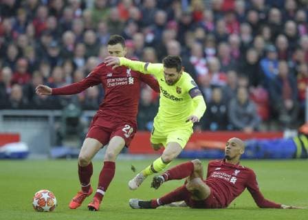 Liverpool United Kingdom 07 05 2019 UEFA Champions League 2018 19 Season Semifinal 2 Round FC Liverpool FC Barcelona Lionel Messi Barcelona Andrew Robertson Liverpool and Fabinho Liverpool battle for the ball DeFodi056