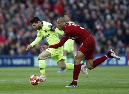 Liverpool s Fabinho tussles with Barcelona s Lionel Messi during the UEFA Champions League match at Anfield, Liverpool. Picture date: 7th May 2019. Picture credit should read: Darren Staples Sportimage EDITORIAL USE ONLY. No use with unauthorised audio, video, data, fixture lists, club league logos or live services. Online in-match use limited to 120 images, no video emulation. No use in betting, games or single club league player publications. SPI-0072-0034