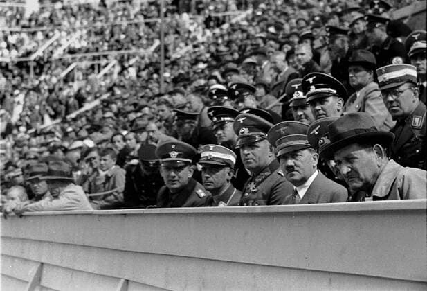 Summer Olympics 1936 - Germany, Third Reich - Olympic Games Olympische Spiele Olympia OS Summer Olympics 1936 in Berlin. Reich Chancellor Adolf Hitler during the competitions - among the spectators. Image date August 1936. , Berlin Deutsches Reich Copyright: ErichxAndres UnitedArchives90062_00646279