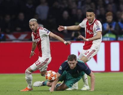 Jan Vertonghen of Tottenham brought down by Hakim Ziyech and Noussair Mazraoui of Ajax during the UEFA Champions League match at the Johan Cruyff Arena, Amsterdam. Picture date: 8th May 2019. Picture credit should read: David Klein Sportimage EDITORIAL USE ONLY. No use with unauthorised audio, video, data, fixture lists, club league logos or live services. Online in-match use limited to 120 images, no video emulation. No use in betting, games or single club league player publications. SPI-0075-0031