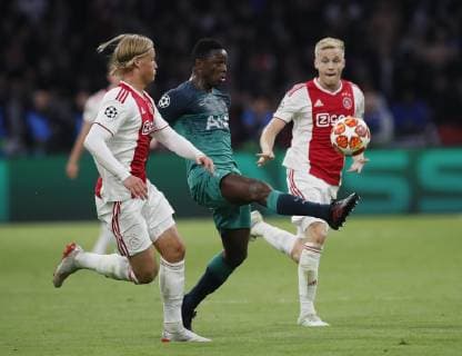 Victor Wanyama of Tottenham feeds the ball through despite Kasper Dolberg of Ajax during the UEFA Champions League match at the Johan Cruyff Arena, Amsterdam. Picture date: 8th May 2019. Picture credit should read: David Klein Sportimage EDITORIAL USE ONLY. No use with unauthorised audio, video, data, fixture lists, club league logos or live services. Online in-match use limited to 120 images, no video emulation. No use in betting, games or single club league player publications. SPI-0075-0034