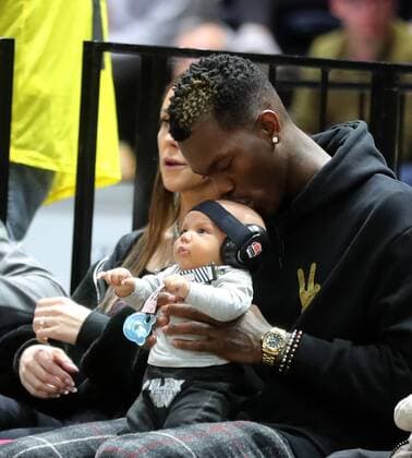 NBA star Dennis Schroeder with wife and child among the spectators