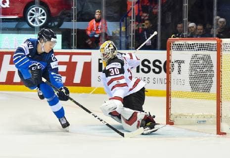 (190511) -- KOSICE, May 11, 2019 -- Kaapo Kakko (L) of Finland shoots during the 2019 IIHF Ice hockey Eishockey World Championship WM Weltmeisterschaft group A game between Finland and Canada at Steel Arena in Kosice, Slovakia, on May 10, 2019. Finland won 3-1. ) (SP)SLOVAKIA-KOSICE-ICE HOCKEY-IIHF-WORLD CHAMPIONSHIP-GROUP A LukaszxLaskowski 