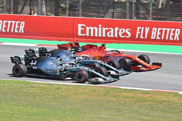 12 05 2019 xekx FIA Formula 1 Grand Prix of Spain 2019 race emspor Start to the race Lewis Hamilton Mercedes AMG Petronas presses inside Valtteri Bottas Mercedes AMG Petronas middle and Sebastian Vettel Ferrari outside past DFL DFB REGULATIONS PROHIBIT ANY USE OF PHOTOGRAPHS as IMAGE SEQUENCES and or QUASI VIDEO Barcelona eel-fotografie Eberhard Krieger