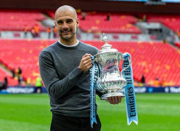 Manchester City Manager Pep Guardiola with the FA Cup during the FA CUP FINAL match between Manchester City and Watford at Wembley Stadium, London, England on 18 May 2019. Copyright: xAndyxRowlandx PMI-2832-0196