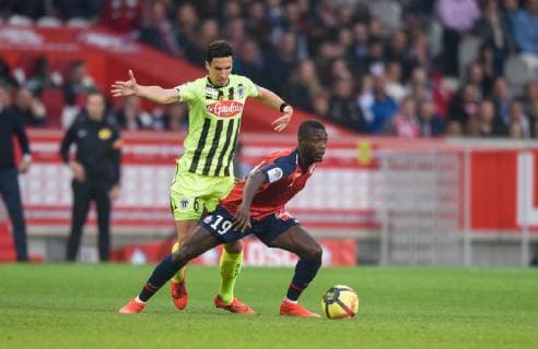 Nicolas Pepe ( LOSC ) - Vincent Pajot ( Angers ) FOOTBALL : Lille OSC vs Angers SCO - Ligue 1 - Lille - 18 05 2019 FedericoPestellini Panoramic 