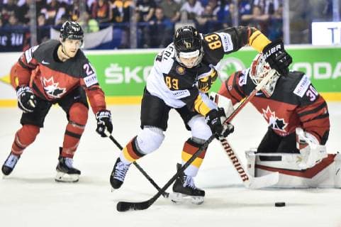(190519) -- KOSICE, May 19, 2019 -- Leonhard Pfoderl (C) of Germany controls the puck during the 2019 IIHF Ice hockey, Eishockey World Championship, WM, Weltmeisterschaft Slovakia group A game between Canada and Germany at Steel Arena on May 18, 2019 in Kosice, Slovakia. Canada won 8-1. ) (SP)SLOVAKIA-KOSICE-ICE HOCKEY-IIHF-WORLD CHAMPIONSHIP-GROUP A-CAN VS GER LukaszxLaskowski 