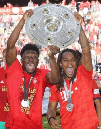 FC Bayern Munich becomes German Champion for the 7th time in a row against Eintracht Frankfurt FC Bayern is German Football Champion of the season 2018 2019 Alphonso Davies and Renato Sanches with championship cheering Munich Bayern Germany Allianz Arena