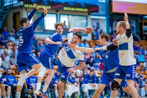 Daniel Zele 28 Dessau Rosslauer HV 06 on the ball with Patrick Hüter 25 TSV Bayer Dormagen , Lukas Stutzke 39 TSV Bayer Dormagen , Daniel Eggert 9 TSV Bayer Dormagen , Libor Hanisch 7 Dessau Rosslauer HV 06 during the match in the Handball 2 Bundesliga Mens Season 2018 2019 between Dessau Rosslauer HV 06 and TSV Bayer Dormagen in the Anhalt Arena on 19 May 2019 in Dessau Rosslau, Saxony Anhalt, Germany.
