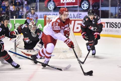 (190521) -- KOSICE, May 21, 2019 -- Kyle Turris (1st R) of Canada tackles Patrick Russell (2nd R) of Denmark during the 2019 IIHF Ice hockey, Eishockey World Championship, WM, Weltmeisterschaft Slovakia group A game between Canada and Denmark at Steel Arena in Kosice, Slovakia, on May 20, 2019. Canada won 5-0. ) (SP)SLOVAKIA-KOSICE-ICE HOCKEY-IIHF-WORLD CHAMPIONSHIP-GROUP A-CAN-DEN LukaszxLaskowski 