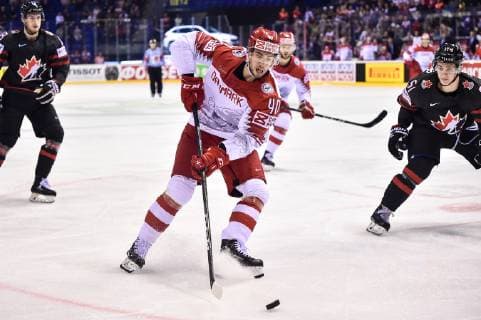 (190521) -- KOSICE, May 21, 2019 -- Jesper Jensen (C, front) of Denmark passes the puck during the 2019 IIHF Ice hockey, Eishockey World Championship, WM, Weltmeisterschaft Slovakia group A game between Canada and Denmark at Steel Arena in Kosice, Slovakia, on May 20, 2019. Canada won 5-0. ) (SP)SLOVAKIA-KOSICE-ICE HOCKEY-IIHF-WORLD CHAMPIONSHIP-GROUP A-CAN-DEN LukaszxLaskowski 