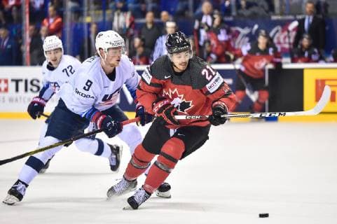 (190522) -- KOSICE, May 22, 2019 -- Jack Eichel (C) of the United States tackles Mathieu Joseph (R) of Canada during the 2019 IIHF Ice hockey, Eishockey World Championship, WM, Weltmeisterschaft Slovakia group A game between Canada and the United States at Steel Arena in Kosice, Slovakia, on May 21, 2019. The United States lost 0-3. ) (SP)SLOVAKIA-KOSICE-ICE HOCKEY-IIHF-WORLD CHAMPIONSHIP-GROUP A-CAN VS USA LukaszxLaskowski 